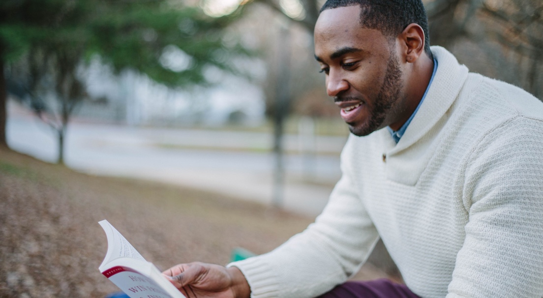 man reading outside